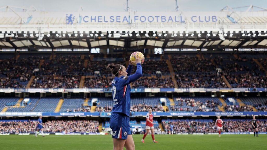 Chelsea Women players celebrating on the pitch at Stamford Bridge