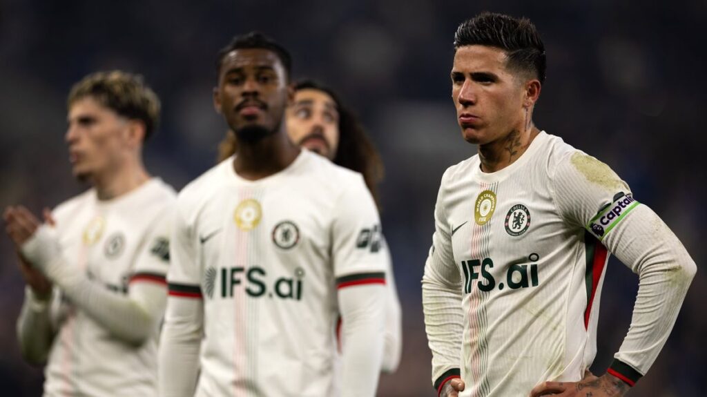 Dejected Chelsea players walking off the pitch following a Premier League defeat
