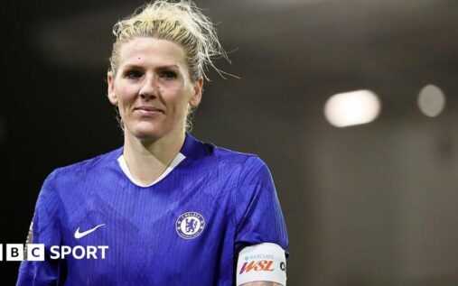Millie Bright wearing the Chelsea captain's armband on the pitch