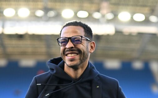 Liam Rosenior standing on the touchline managing Chelsea during a Premier League match