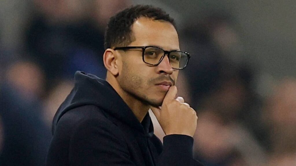 Chelsea manager Liam Rosenior looking serious on the touchline during a match