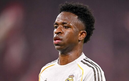 Real Madrid forward Vinicius Junior looking thoughtful on the football pitch