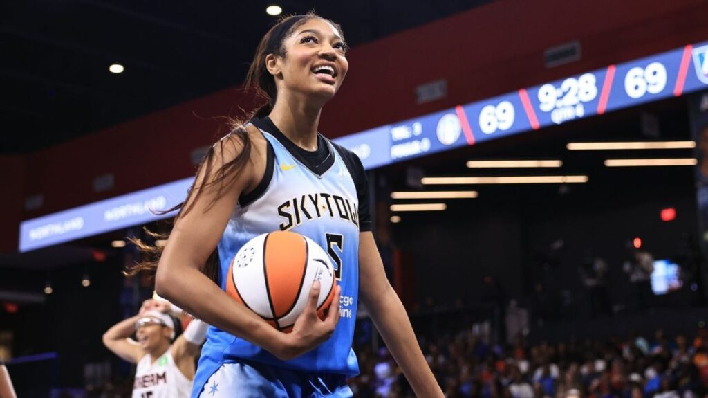 Angel Reese playing basketball in a Chicago Sky uniform during a WNBA game