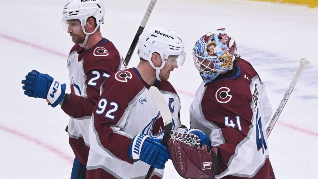 Colorado Avalanche ice hockey players celebrating a goal against the St Louis Blues