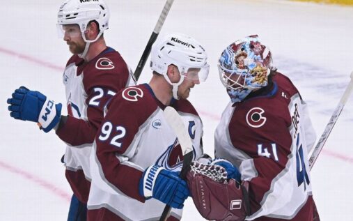Colorado Avalanche ice hockey players celebrating a goal against the St Louis Blues