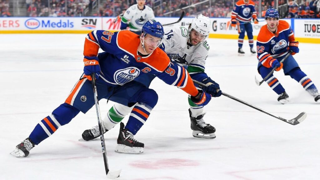 Connor McDavid of the Edmonton Oilers skating with the puck during an NHL match