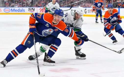 Connor McDavid of the Edmonton Oilers skating with the puck during an NHL match