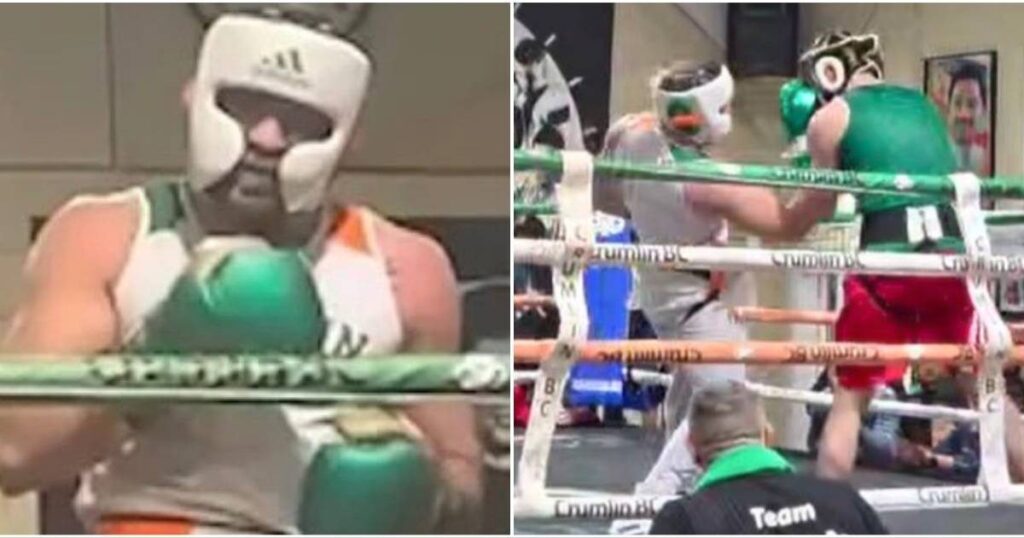Conor McGregor wearing boxing gloves and protective headgear during an exhibition match in a Dublin boxing ring.