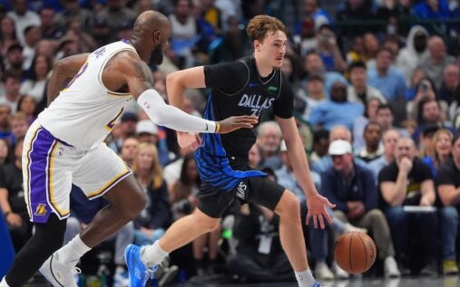Dallas Mavericks rookie Cooper Flagg dribbling the basketball on the court