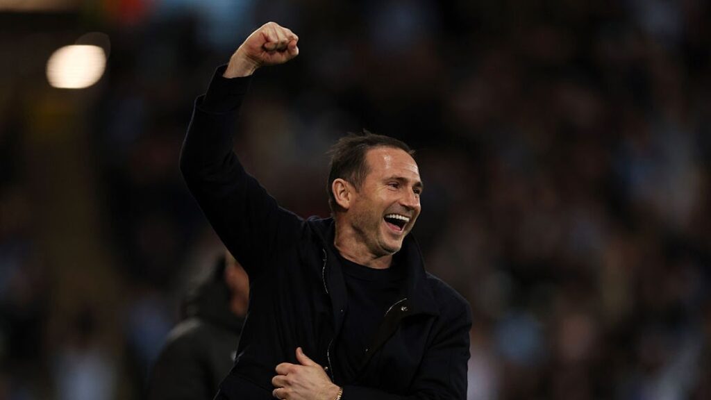 Coventry City manager Frank Lampard celebrating with his players after winning the Championship title.