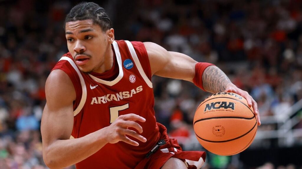 Arkansas guard Darius Acuff Jr dribbling the basketball during an NCAA college game