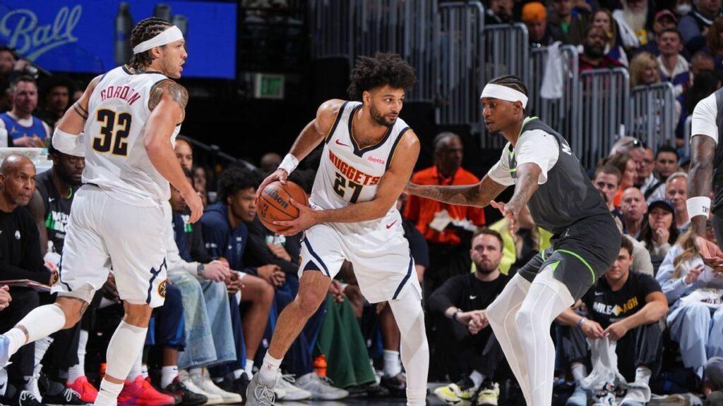 Jamal Murray of the Denver Nuggets dribbling the basketball during an NBA playoff game against the Timberwolves