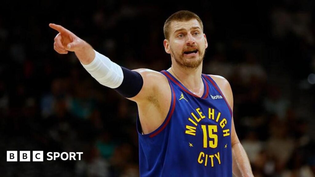 Nikola Jokic of the Denver Nuggets handling the basketball during an NBA game