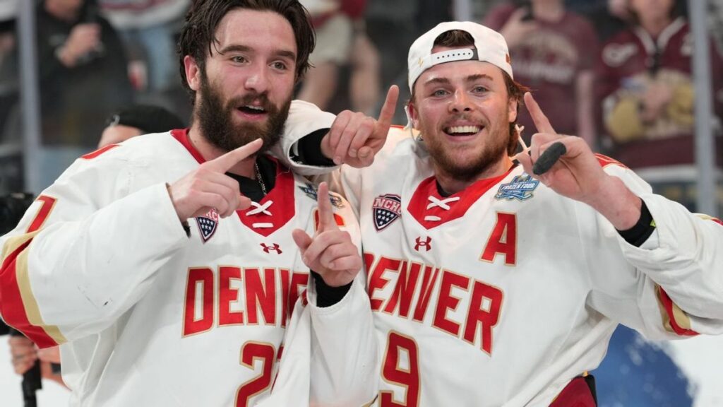 Denver Pioneers men's ice hockey players celebrating their NCAA national championship victory