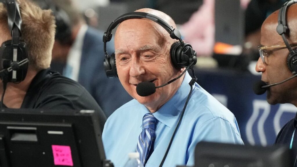 ESPN college basketball broadcaster Dick Vitale smiling courtside