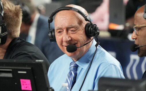 ESPN college basketball broadcaster Dick Vitale smiling courtside