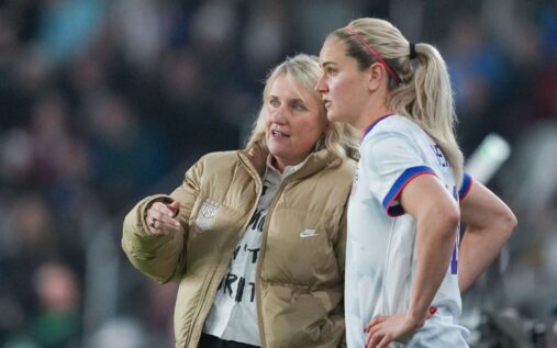 USWNT head coach Emma Hayes standing on the touchline looking thoughtful during an international football match