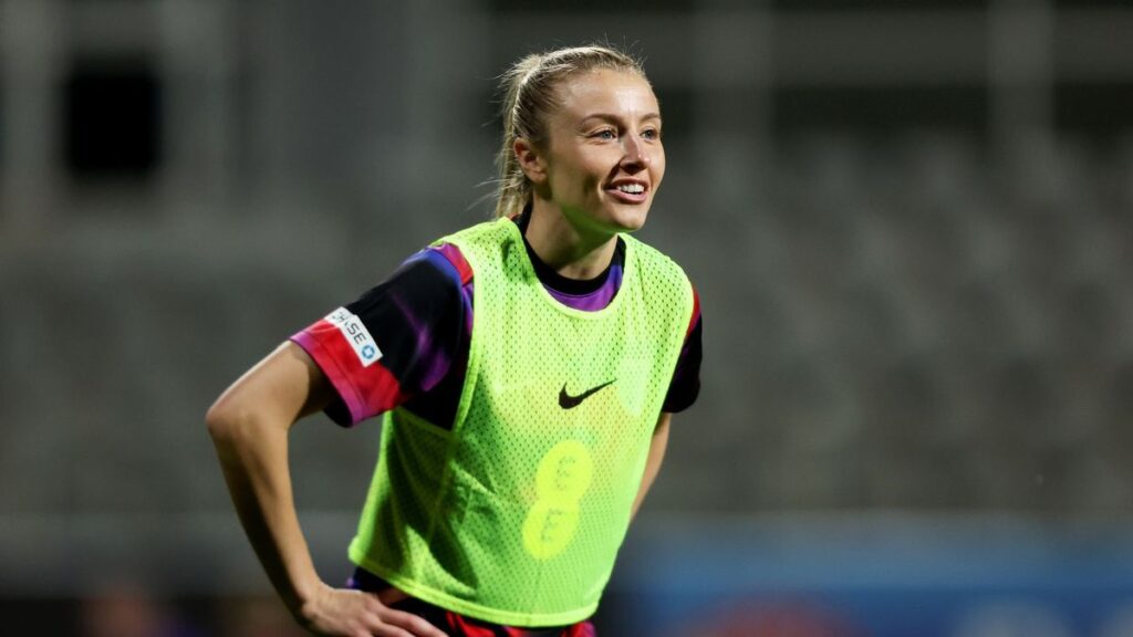 Leah Williamson warming up for England ahead of a crucial international football match