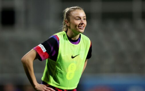 Leah Williamson warming up for England ahead of a crucial international football match