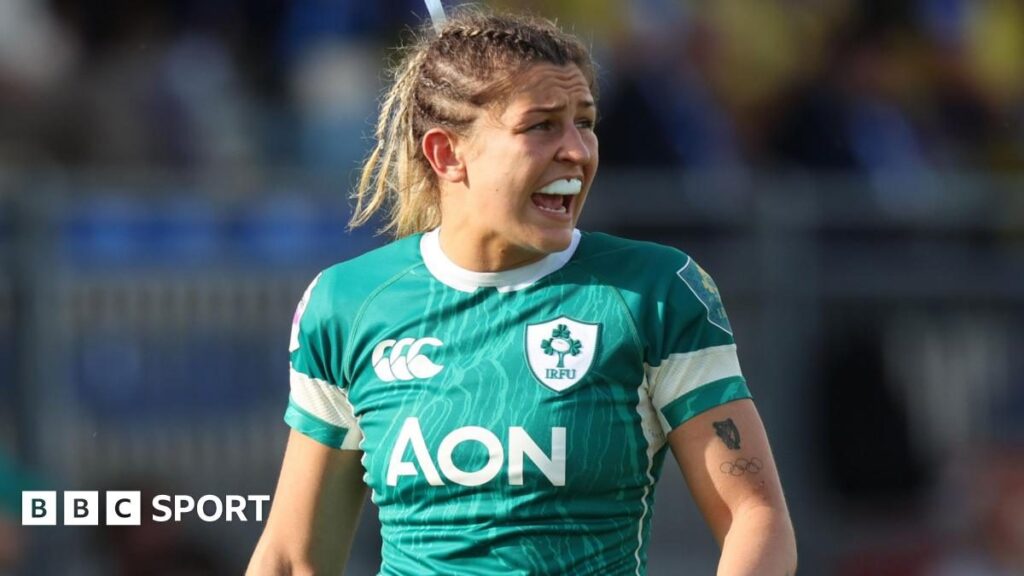 Ireland rugby captain Erin King passing the ball during an international match