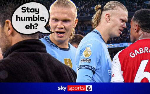 Erling Haaland confronting Arsenal defenders during a Premier League match