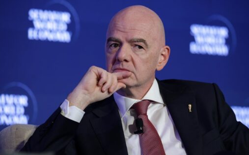 Football fans holding match tickets outside a stadium at the World Cup