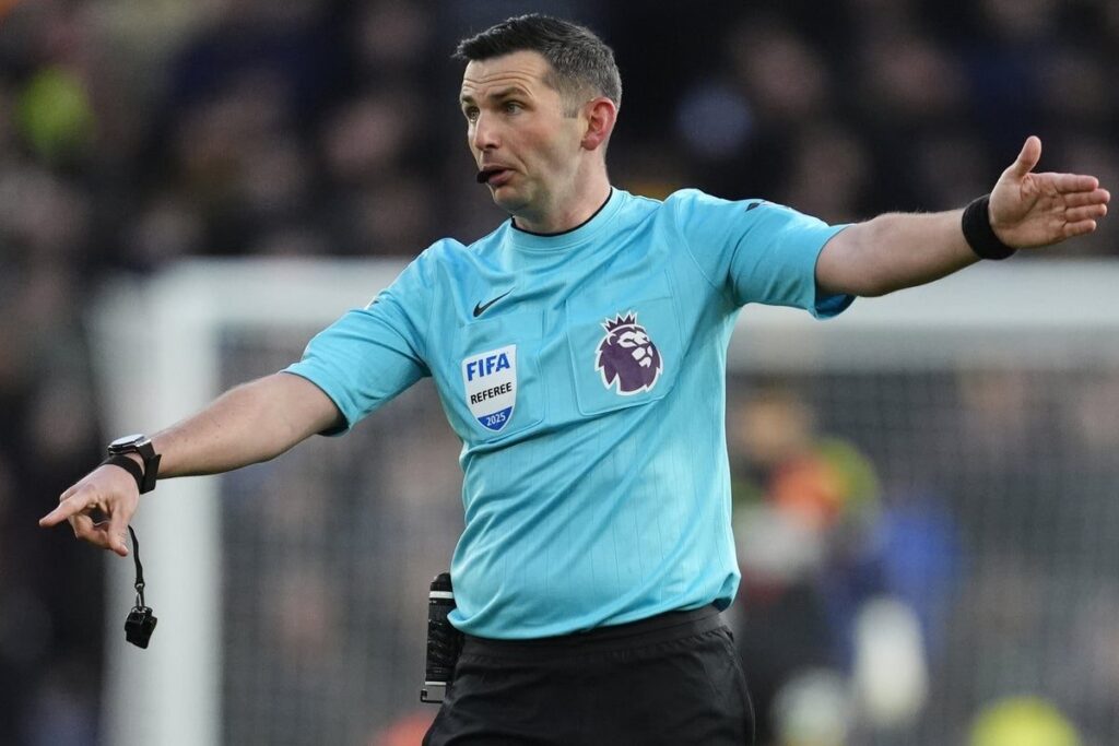 Premier League referee Michael Oliver officiating a football match on the pitch