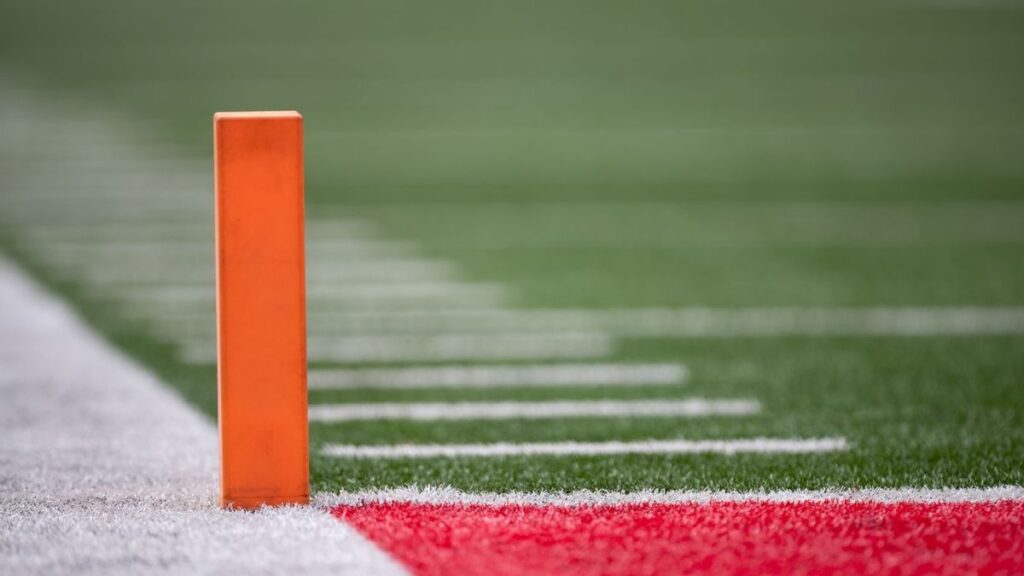 NFL football and legal gavel resting on federal court documents