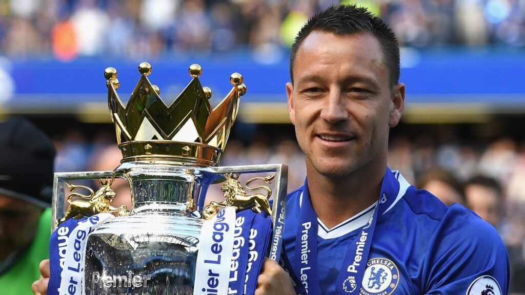 Former Chelsea captain John Terry applauding supporters from the pitch