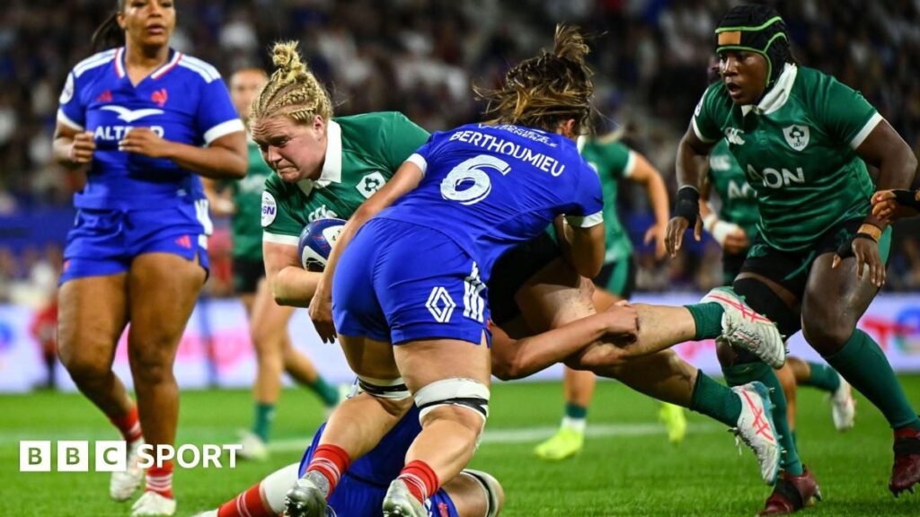 France women's rugby players celebrating a try against Ireland during their Six Nations match in Clermont