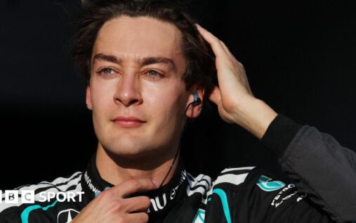 Mercedes driver George Russell speaking in his team apparel at the newly opened Silverstone karting centre.