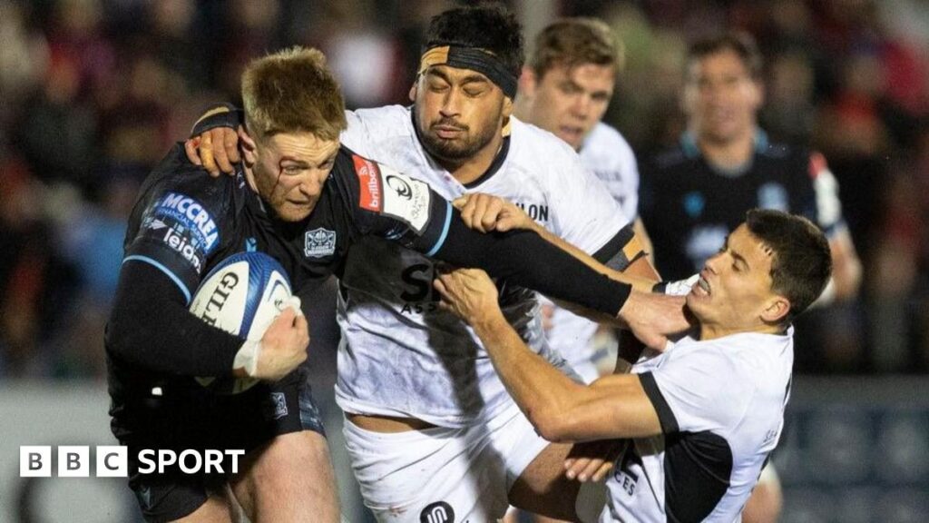 Glasgow Warriors players in action during a European Champions Cup rugby match at Scotstoun Stadium