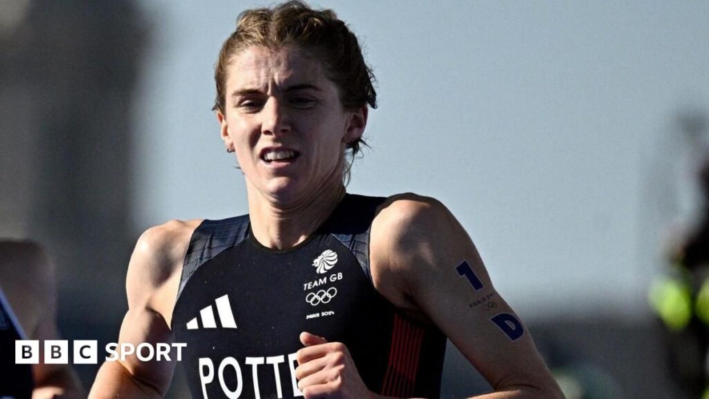 Beth Potter crossing the finish line to win the World Triathlon Championship Series in Samarkand
