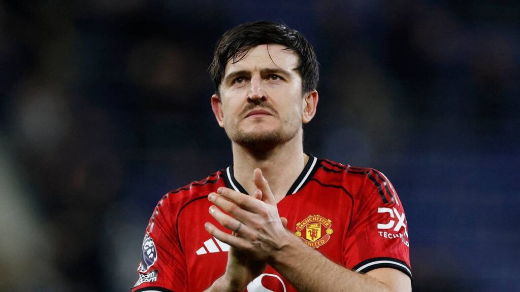 Manchester United defender Harry Maguire walking off the pitch after receiving a red card