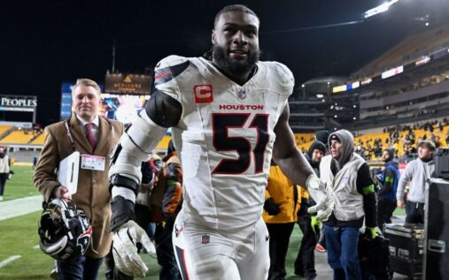 Houston Texans defensive end Will Anderson Jr rushing the quarterback on the field