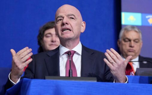 Iran national football team players line up on the pitch ahead of an international match