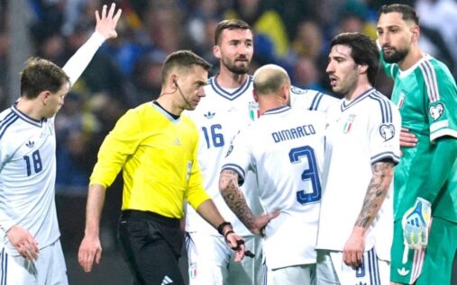 Dejected Italian national football team players walking off the pitch