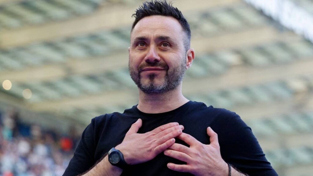 James Maddison walking on the training pitch in a Tottenham Hotspur kit
