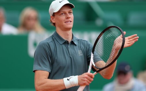 Jannik Sinner hitting a forehand on a clay court at the Monte Carlo Masters