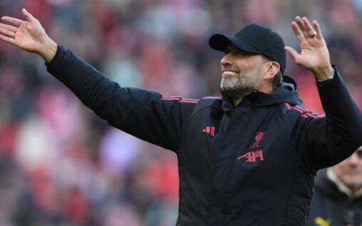 Jurgen Klopp smiling on the pitch during the Liverpool Legends charity match at Anfield.