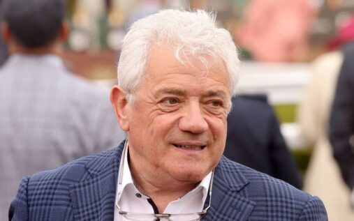 Kevin Keegan smiling and waving to supporters during his time as manager of Newcastle United