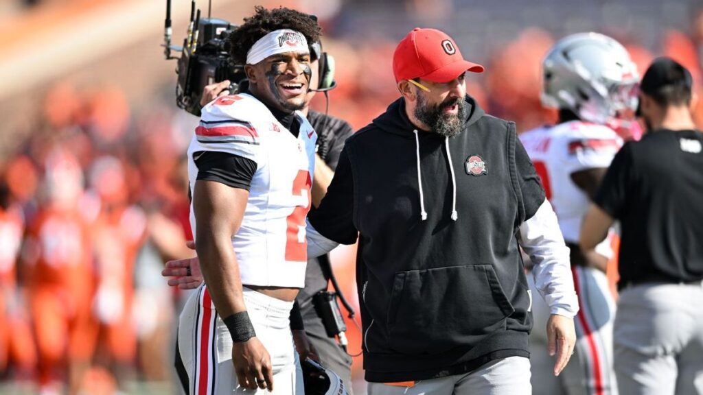 Indiana quarterback Fernando Mendoza preparing to throw a pass during a college football game.