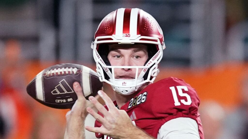 Fernando Mendoza preparing to throw a pass during a college football game