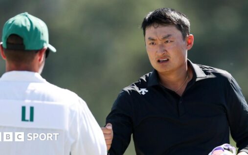 Golfer Li Haotong playing a shot on the fairway during the Masters tournament at Augusta National