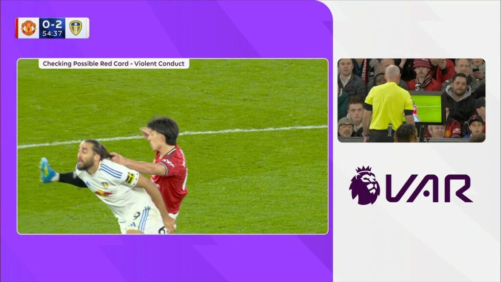 Lisandro Martinez of Manchester United receives a red card from the referee