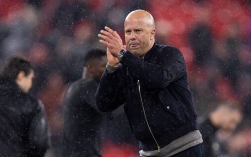 Liverpool manager Arne Slot looking thoughtful on the touchline