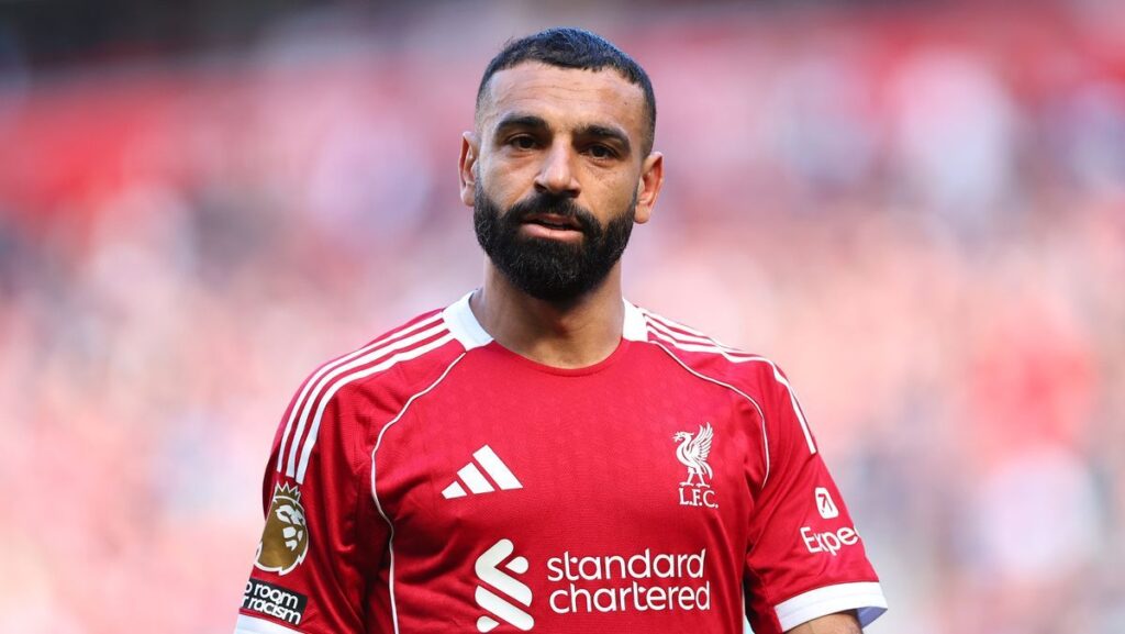 Mohamed Salah walking off the pitch at Anfield in a Liverpool kit