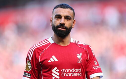 Mohamed Salah walking off the pitch at Anfield in a Liverpool kit