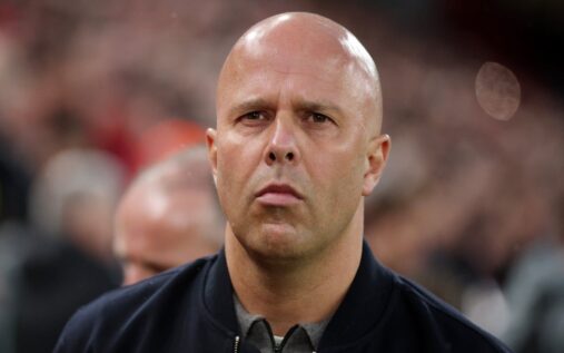 Liverpool manager Arne Slot looking thoughtful on the touchline during a match