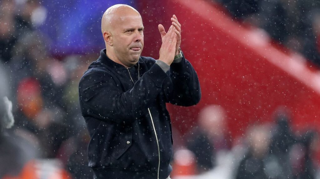 Liverpool manager Arne Slot looking thoughtful on the touchline during a Premier League match